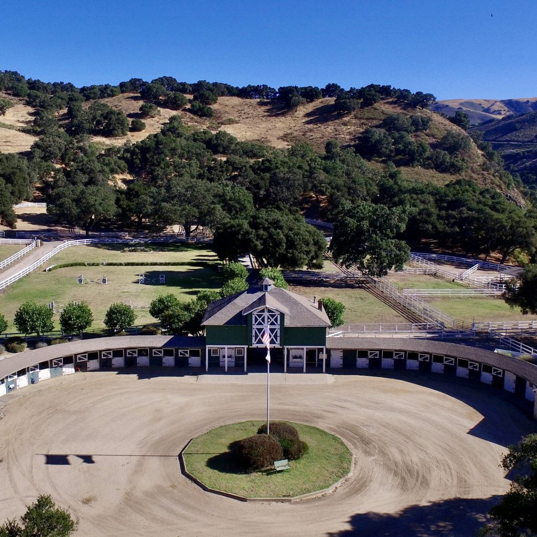 Aerial view of the horse barn and riding arena at Stonepine Estate, Carmel Valley (square crop)
