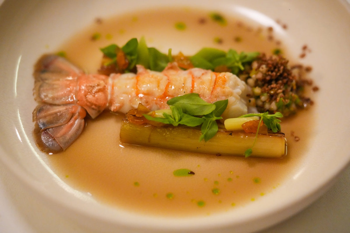 Langoustine with leeks and herbs in a light broth, a course at La Mère Brazier, Lyon